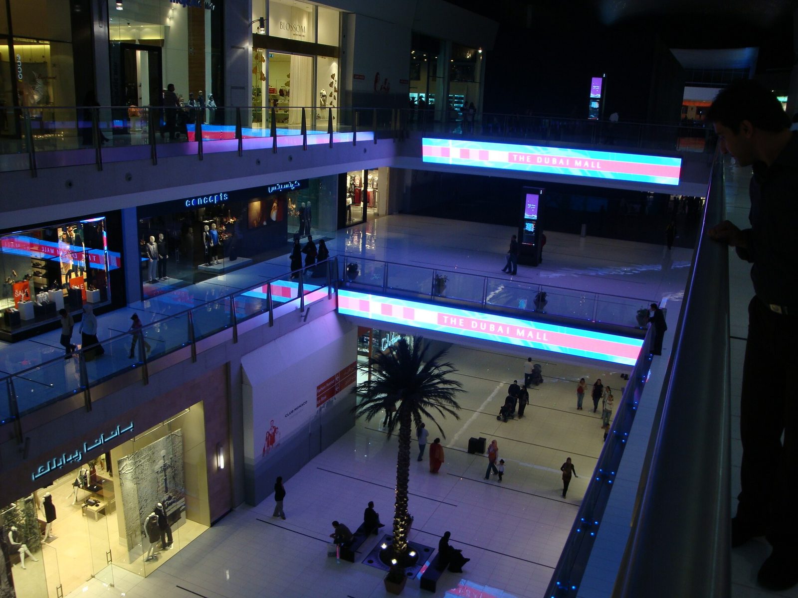 A modern multi-level interior lit at night.