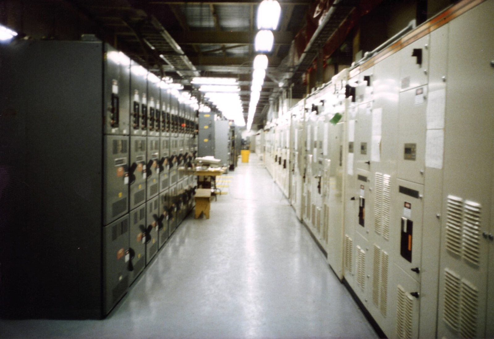 A line-up of motor control centre switchgear panels in a plant room.