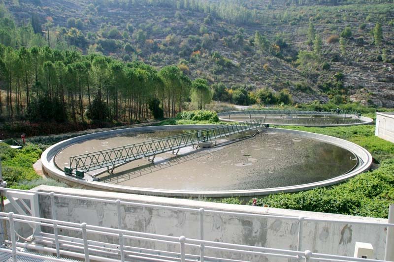 A circular clarifier tank at a water treatment facility.